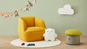 Lip kid sofa and fungo kid pouf are placed in the living room