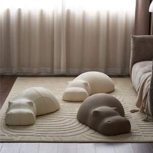 3 Styles Of Hippo Pouf Placed On The Carpet